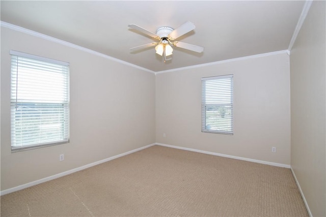 unfurnished room featuring baseboards, light carpet, ornamental molding, and a ceiling fan