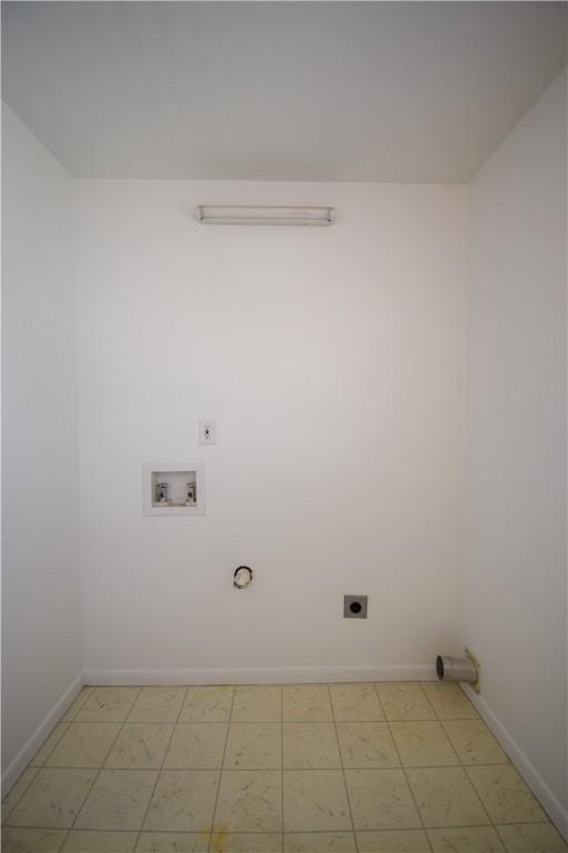 washroom featuring electric dryer hookup, baseboards, washer hookup, and laundry area