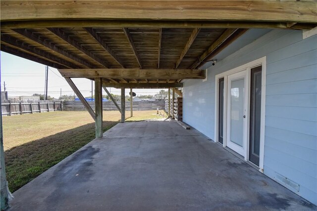 view of patio featuring fence