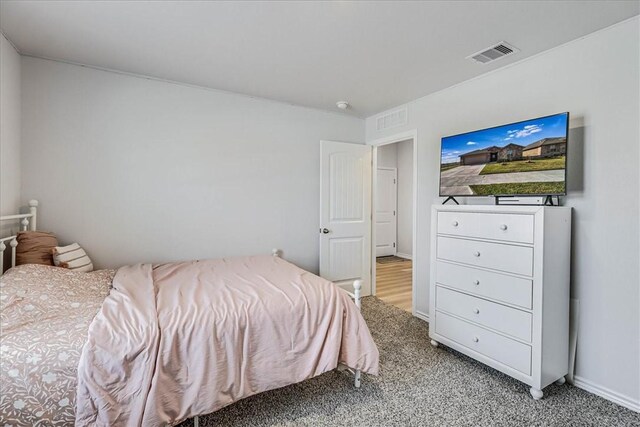 bedroom with carpet flooring and visible vents