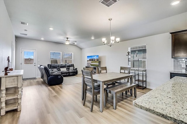 dining area featuring ceiling fan with notable chandelier, light wood-type flooring, visible vents, and recessed lighting