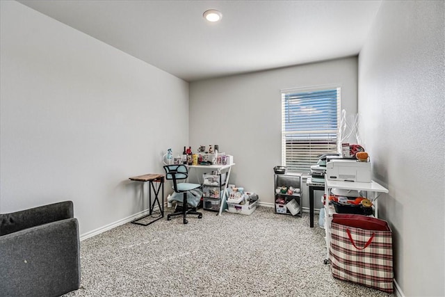 carpeted office space featuring baseboards