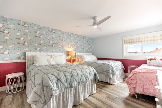 bedroom featuring wood-type flooring and ceiling fan