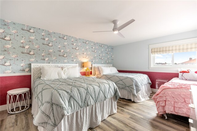 bedroom featuring wood-type flooring and ceiling fan