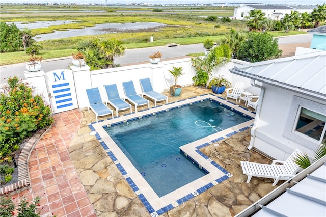 view of swimming pool with a patio area