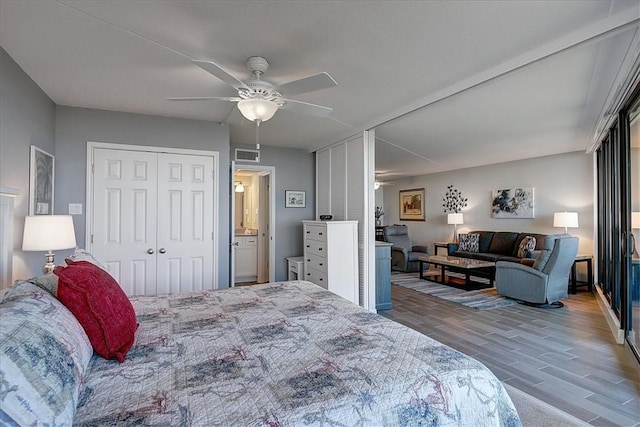 bedroom featuring ceiling fan and hardwood / wood-style flooring