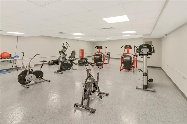 gym featuring a paneled ceiling