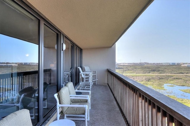 balcony featuring a rural view