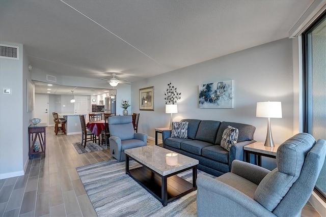 living room featuring ceiling fan