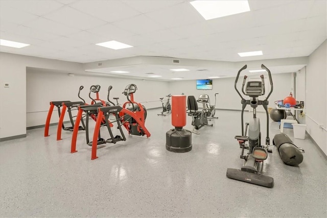 exercise room with a drop ceiling