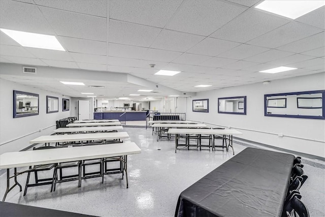 dining space featuring a paneled ceiling