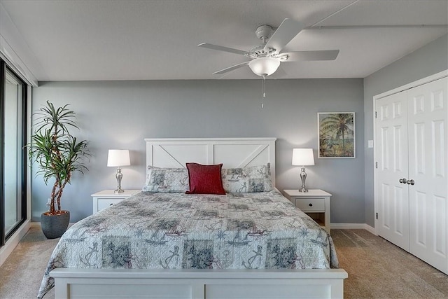 bedroom featuring ceiling fan, light colored carpet, and a closet