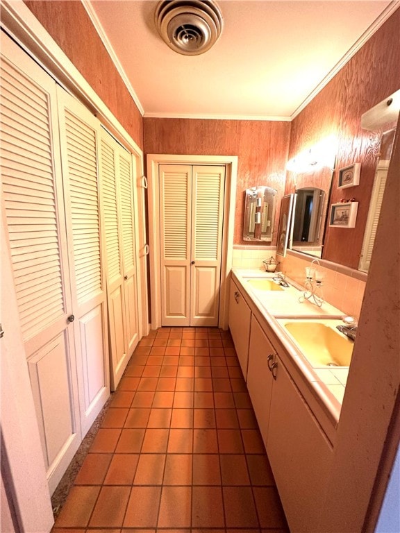 bathroom with vanity, tile patterned floors, and crown molding