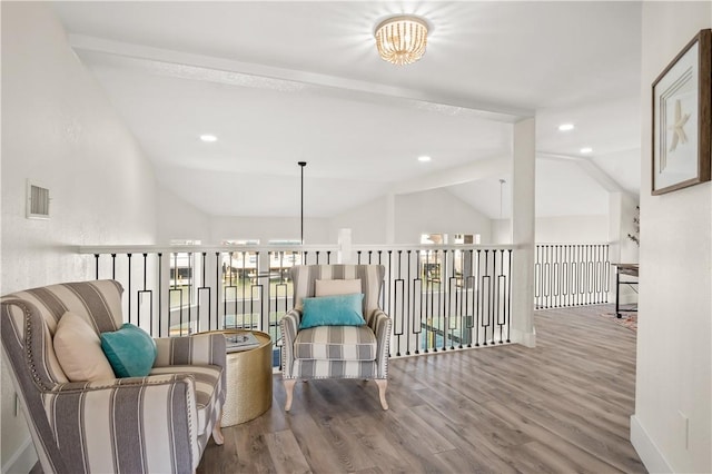 sitting room featuring vaulted ceiling with beams, recessed lighting, visible vents, wood finished floors, and baseboards