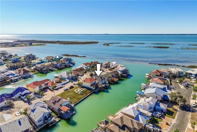 birds eye view of property featuring a water view and a residential view