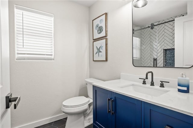 full bath featuring tile patterned flooring, toilet, vanity, baseboards, and a shower