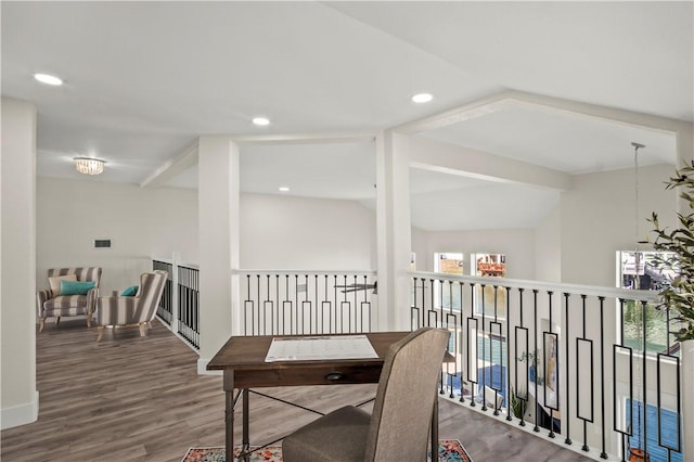 interior space featuring lofted ceiling, wood finished floors, and recessed lighting