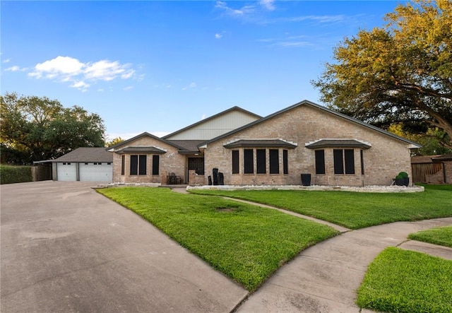 view of front of property with a garage and a front lawn