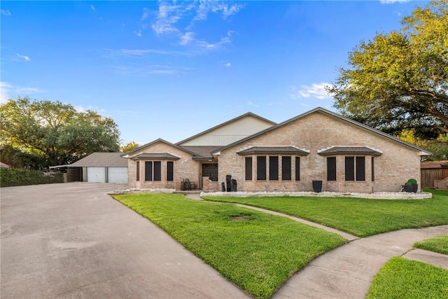 view of front of property featuring a garage and a front yard