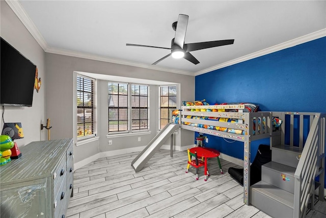 bedroom featuring ceiling fan, crown molding, and light hardwood / wood-style flooring