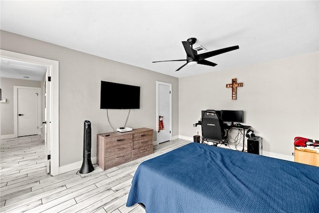 bedroom with ceiling fan and light hardwood / wood-style flooring