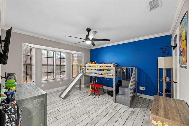 bedroom featuring ceiling fan, light hardwood / wood-style floors, and ornamental molding