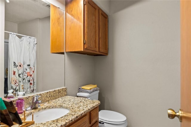 bathroom with vanity and toilet