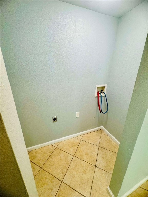 clothes washing area featuring washer hookup, tile patterned flooring, and hookup for an electric dryer