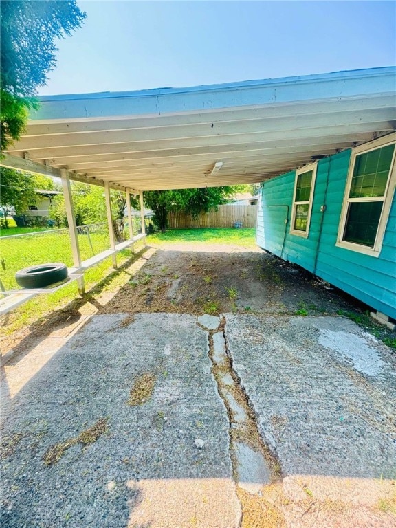 exterior space with a carport