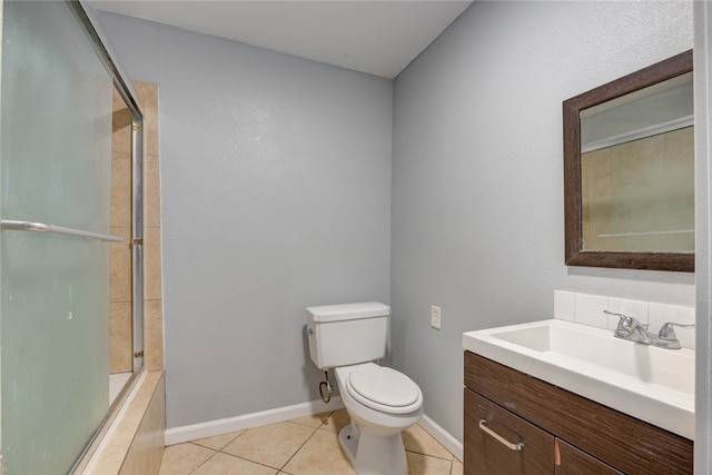 bathroom featuring tile patterned floors, toilet, baseboards, and shower / bath combination with glass door