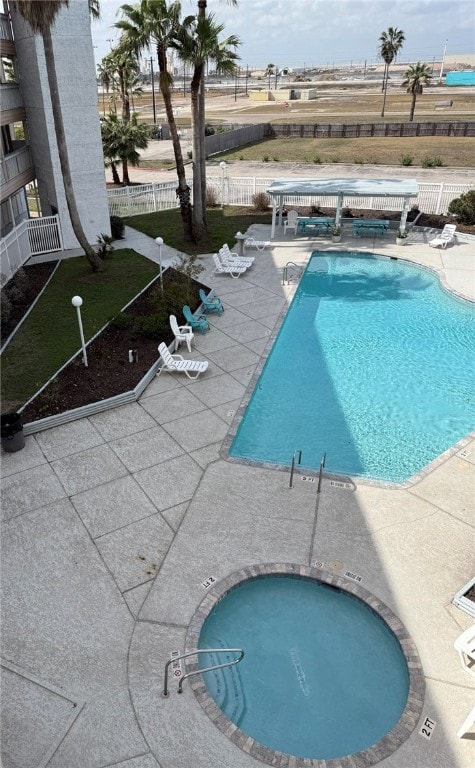 3938 Surfside Blvd Unit 3225, Corpus Christi, TX 78402 - view of swimming pool with a community hot tub and a patio area