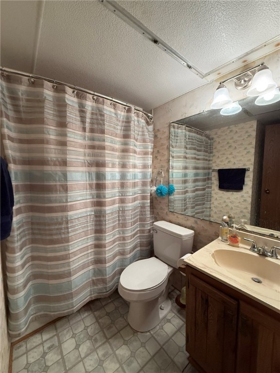 3938 Surfside Blvd Unit 3225, Corpus Christi, TX 78402 - bathroom with vanity, toilet, and a textured ceiling