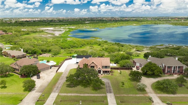 birds eye view of property with a water view