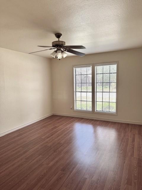 4202 Wolf Creek Dr, Corpus Christi, TX 78413 - spare room featuring dark wood-type flooring and a ceiling fan