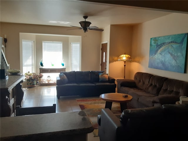 living room featuring ceiling fan and light tile patterned flooring