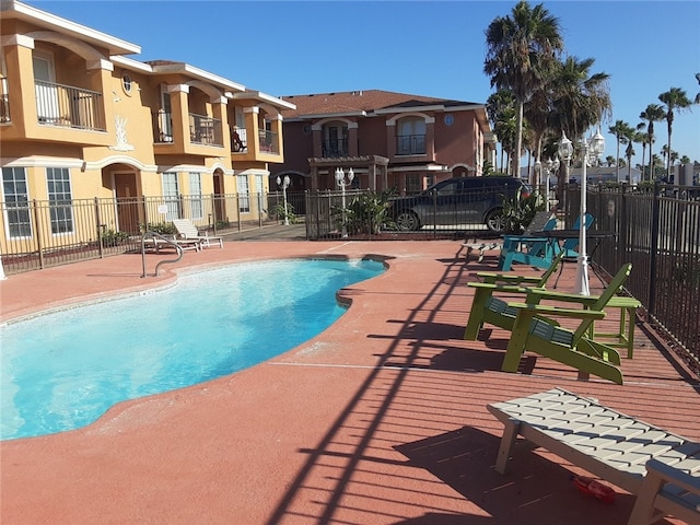 view of swimming pool featuring a patio area