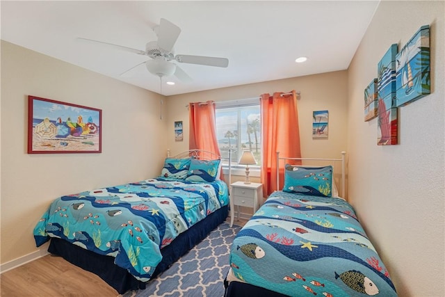 bedroom featuring baseboards, recessed lighting, ceiling fan, and wood finished floors