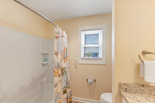 full bathroom with baseboards, toilet, and curtained shower