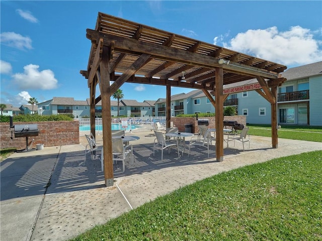 view of patio / terrace featuring a community pool, fence, a pergola, and a grill