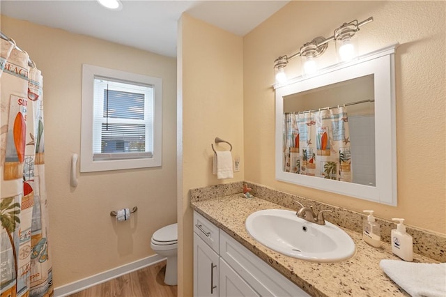 full bathroom with gas water heater, wood finished floors, vanity, toilet, and a shower with shower curtain