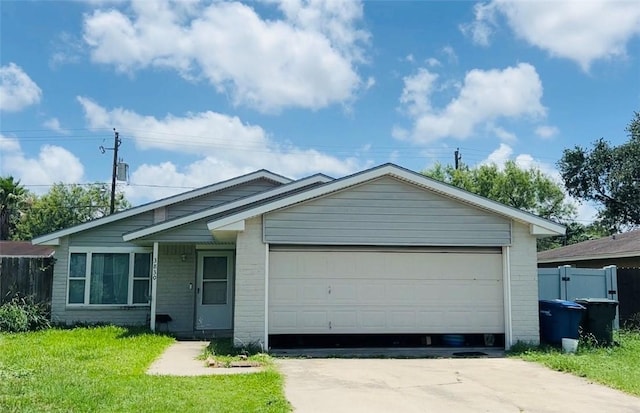 single story home with driveway, a garage, and brick siding
