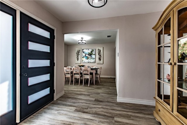 entrance foyer with dark hardwood / wood-style flooring