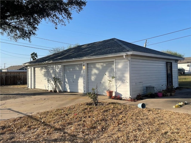 detached garage with fence