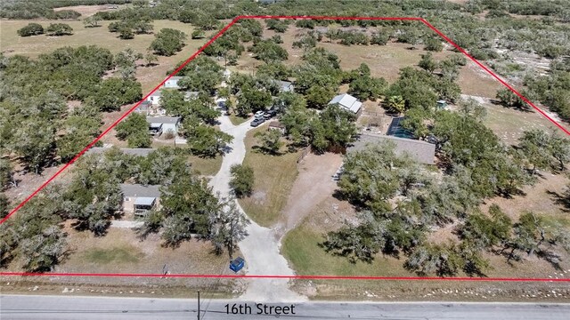 birds eye view of property featuring a rural view