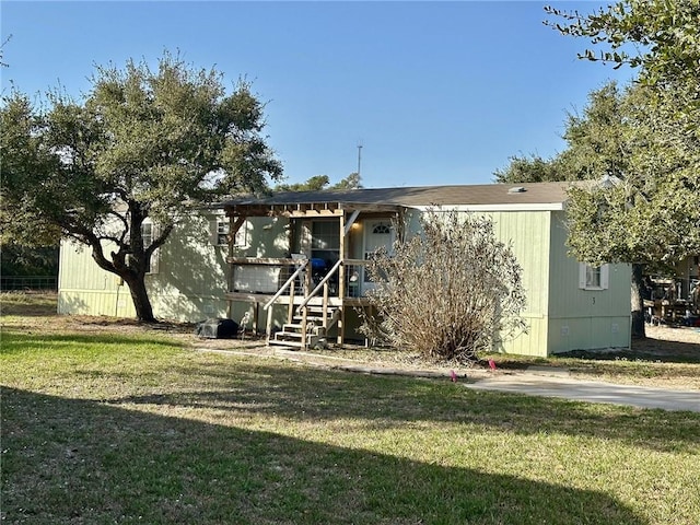 view of front of property with a front lawn and a deck