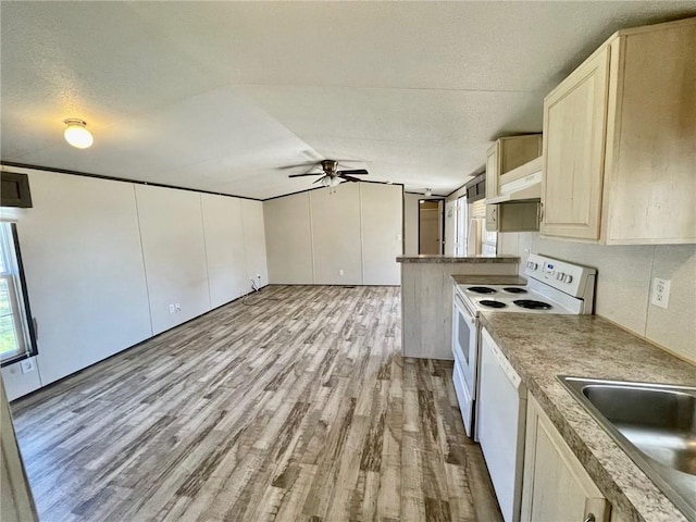 kitchen with wood finished floors, lofted ceiling, white appliances, ceiling fan, and under cabinet range hood