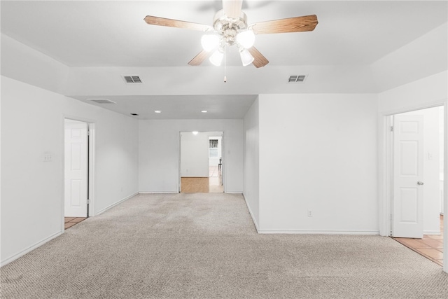 carpeted empty room featuring ceiling fan