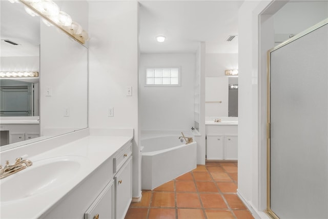 bathroom with shower with separate bathtub, tile patterned floors, and vanity