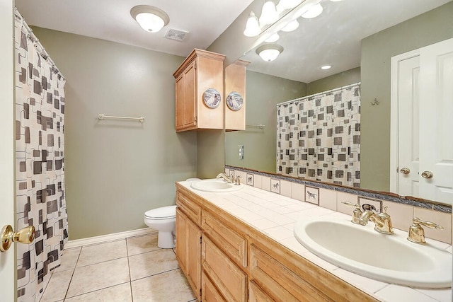 6613 Belvoir Ave, Corpus Christi, TX 78414 - full bathroom with double vanity, tile patterned floors, and curtained shower