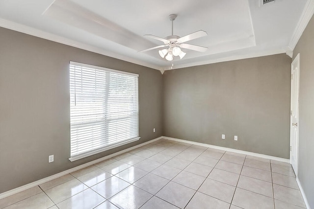 6613 Belvoir Ave, Corpus Christi, TX 78414 - empty room with a tray ceiling, ceiling fan, light tile patterned floors, and crown molding